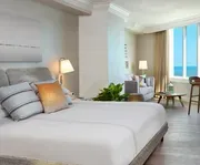 Photo of Pelican Grand Beach Resort - A Noble House Resort Room