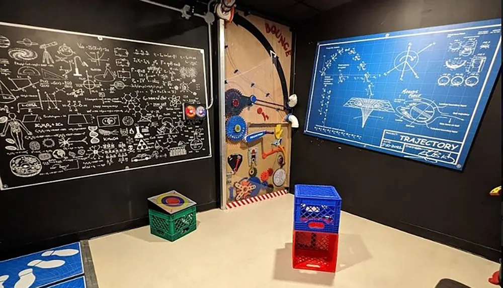 The image shows a playful and educational room decorated with a blackboard covered in scientific diagrams and equations a Rube Goldberg-style machine on the door blueprints and colorful target games on the floor