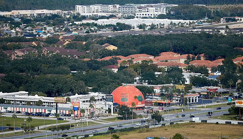 The image is an aerial view of a suburban area with a large orange dome-shaped building prominently labeled Florida Citrus Center amid roads smaller commercial buildings and residential neighborhoods