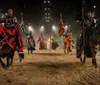 Two knights on horseback are engaged in a staged sword fight at a medieval-themed tournament as spectators watch from the stands