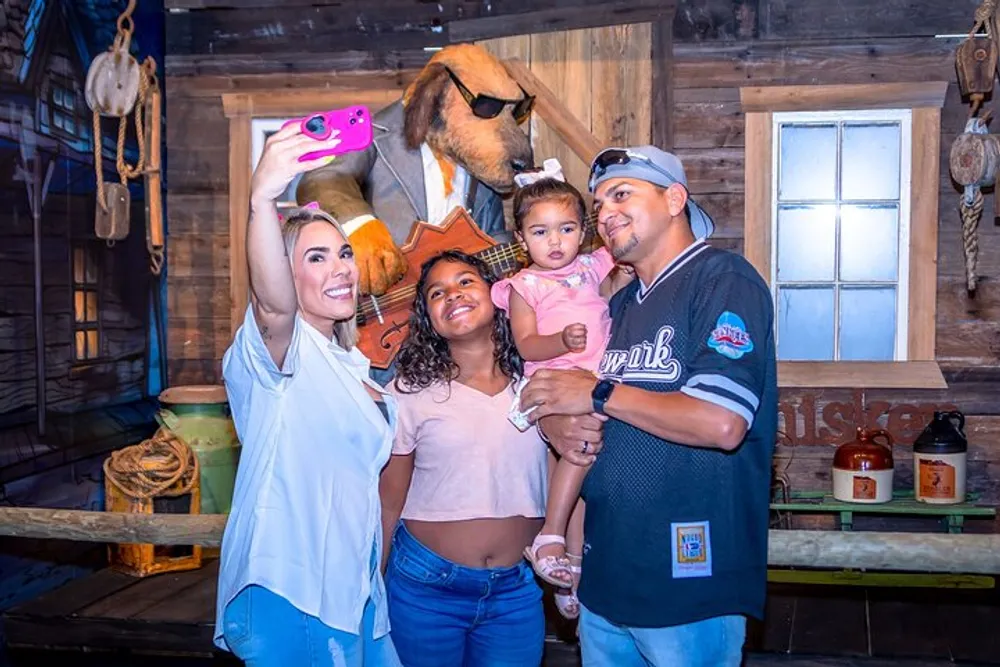 A family is taking a selfie with a person wearing an oversized dog costume in a rustic-themed environment