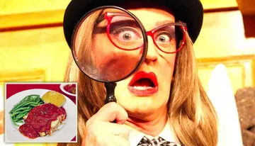 The image shows a person with exaggerated facial expressions, wearing a hat and glasses, holding a large magnifying glass up to one eye.