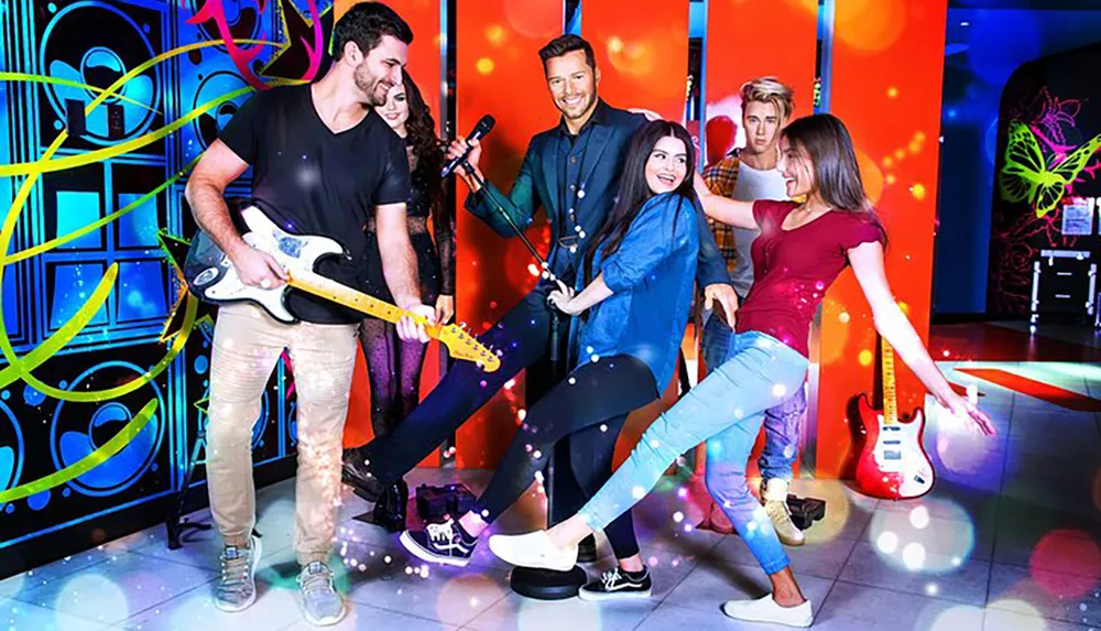 A group of young adults is enjoying a lively karaoke session with guitars in a vibrant neon-lit room