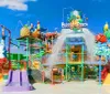 This is a colorful and vibrant water play structure for children with slides sprayers and a large tipping bucket under a clear blue sky