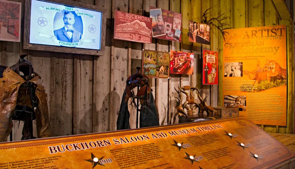 The image showcases an interior view of a museum likely the Buckhorn Saloon and Museum with displays including a timeline historical photos information about taxidermy and various artifacts