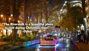 A vibrant evening scene shows people enjoying a boat ride along a tree-lined river adorned with festive lights, with onlookers standing on a bridge and others strolling along the riverside walkways.
