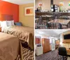 The image shows a neatly arranged hotel room with two queen-size beds a nightstand with a lamp between them a vibrant orange accent wall and a bold patterned carpet