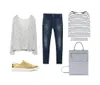 The image shows a flat lay of a casual fashionable outfit including golden sneakers blue jeans a grey long-sleeve top a striped shirt and a grey backpack