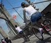 A person is photographing the Brooklyn Bridge in New York City